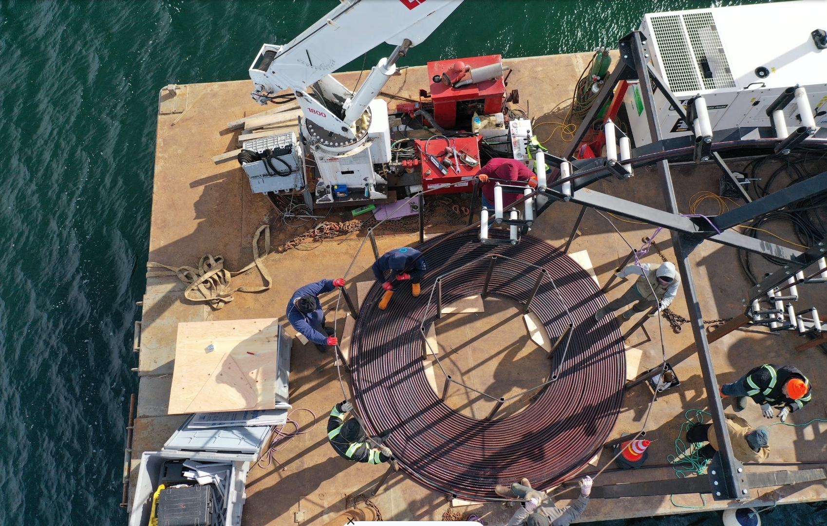 Overhead view of cable being loaded onto barge in Belfast in February